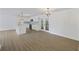 Open-concept living space with a view to the kitchen and dining area, perfect for gatherings at 4765 S Constellation Dr, North Charleston, SC 29418