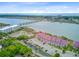 Expansive aerial view featuring waterfront condos, a bridge to town, beach access, and scenic coastal beauty at 5 Mariners Cay Dr, Folly Beach, SC 29439