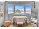 Bright bedroom featuring a desk with waterfront views, wooden floors, and neutral decor, creating a tranquil workspace at 5 Mariners Cay Dr, Folly Beach, SC 29439