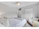 Comfortable bedroom features a bed, chair, closet, and neutral tones, creating a serene and inviting retreat at 5 Mariners Cay Dr, Folly Beach, SC 29439