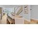 Open dining room featuring a wooden table, bench, modern staircase, and bright, airy living spaces at 5 Mariners Cay Dr, Folly Beach, SC 29439