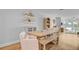 Elegant dining space with a wooden table, bench seating, and modern décor for a stylish and inviting atmosphere at 5 Mariners Cay Dr, Folly Beach, SC 29439