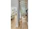 Hallway with staircase and coat rack leading into an open-concept living space at 5 Mariners Cay Dr, Folly Beach, SC 29439