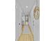 Inviting hallway with light wood floors, neutral paint and a glimpse into the bright, airy interior at 5 Mariners Cay Dr, Folly Beach, SC 29439