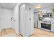 Bright, updated kitchen with stainless steel appliances and ample white cabinetry providing excellent storage at 5 Mariners Cay Dr, Folly Beach, SC 29439