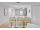 Bright and modern kitchen featuring a breakfast bar with seating, stainless steel appliances and neutral color palette at 5 Mariners Cay Dr, Folly Beach, SC 29439