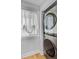 Convenient laundry area showcasing modern washer and dryer units with natural light from the adjacent window at 5 Mariners Cay Dr, Folly Beach, SC 29439
