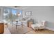 Stylish living room featuring large windows, comfortable seating, and scenic views for a bright and inviting atmosphere at 5 Mariners Cay Dr, Folly Beach, SC 29439