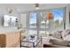 Cozy living room with water view, modern ceiling fan, and lots of natural light at 5 Mariners Cay Dr, Folly Beach, SC 29439
