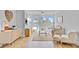 Bright living room featuring water view, stylish furniture, and modern decor at 5 Mariners Cay Dr, Folly Beach, SC 29439