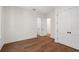Bright bedroom featuring hardwood floors, fresh paint, closet and access to additional living space at 5105 St George Ln, Hollywood, SC 29449