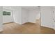 Bright bedroom with hardwood floors, white walls, and multiple entryways that create open space and freedom at 5105 St George Ln, Hollywood, SC 29449