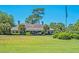 Beautiful clubhouse exterior with well-manicured lawn and landscaping at 5105 St George Ln, Hollywood, SC 29449