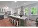 Modern kitchen with stainless steel appliances, central island and hardwood flooring at 5105 St George Ln, Hollywood, SC 29449