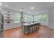 Bright kitchen features a center island with seating and stainless steel appliances at 5105 St George Ln, Hollywood, SC 29449