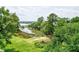 Scenic landscape featuring a picturesque pond and lush greenery, offering a tranquil setting at 5105 St George Ln, Hollywood, SC 29449