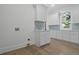 Laundry room featuring a sink, white cabinetry, and modern fixtures at 5105 St George Ln, Hollywood, SC 29449