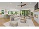 Open-concept living room boasts modern fireplace, comfortable seating, and a connection to the kitchen at 5105 St George Ln, Hollywood, SC 29449