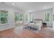 Beautiful main bedroom with neutral decor, patio access and windows overlooking outdoor scenery at 5105 St George Ln, Hollywood, SC 29449
