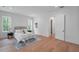 Well-lit main bedroom with hardwood floors, a neutral color palette, and abundant natural light at 5105 St George Ln, Hollywood, SC 29449