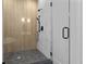 Contemporary walk-in shower with glass door, marble tile walls, and modern fixtures at 5105 St George Ln, Hollywood, SC 29449