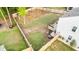 Aerial view of spacious fenced backyard with lush green grass and mature trees at 514 Shady Maple St, Moncks Corner, SC 29461