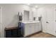 Bathroom featuring dual sink vanity, white cabinets, and modern fixtures at 514 Shady Maple St, Moncks Corner, SC 29461