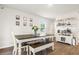 Bright dining area with wood table, bench seating, and a coffee bar setup at 514 Shady Maple St, Moncks Corner, SC 29461
