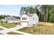 Inviting home with a brick-accented garage, lush lawn, and tidy landscaping at 514 Shady Maple St, Moncks Corner, SC 29461