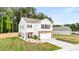 Well-maintained home featuring a two-car garage, beautiful lawn, and classic architectural details at 514 Shady Maple St, Moncks Corner, SC 29461