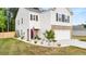 Attractive home with neat landscaping, brick-accented garage, and welcoming front entrance at 514 Shady Maple St, Moncks Corner, SC 29461