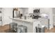 Modern kitchen featuring stainless steel appliances, a kitchen island with bar seating, and sleek cabinetry at 514 Shady Maple St, Moncks Corner, SC 29461