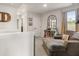 Carpeted upstairs landing with a chaise and reading nook by a window at 514 Shady Maple St, Moncks Corner, SC 29461