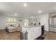 A stylish kitchen overlooks the living area, stainless steel appliances, and a cozy living space at 514 Shady Maple St, Moncks Corner, SC 29461