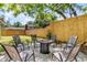 Beautiful backyard with gravel firepit, plenty of seating, and new wood fence at 5155 Monterey St, North Charleston, SC 29405