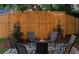 Cozy backyard fire pit with seating, surrounded by a wood fence and ambient lighting, ideal for gatherings at 5155 Monterey St, North Charleston, SC 29405