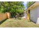 Spacious backyard with well-maintained lawn, privacy fence, and an outdoor seating area at 5155 Monterey St, North Charleston, SC 29405