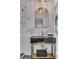Elegant bathroom featuring black vanity with gold accents, a large mirror and textured marble tiling at 5155 Monterey St, North Charleston, SC 29405