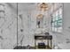 Stylish bathroom with a black vanity, gold fixtures, and glass-enclosed shower at 5155 Monterey St, North Charleston, SC 29405