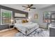 Comfortable bedroom with a padded headboard, neutral walls, and bright natural light at 5155 Monterey St, North Charleston, SC 29405