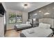 Charming bedroom with twin beds, a moon and stars accent wall, and natural light from a large window at 5155 Monterey St, North Charleston, SC 29405