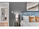 Comfortable bedroom with a blue headboard, neutral walls, and gold decor at 5155 Monterey St, North Charleston, SC 29405