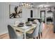 Elegant dining room featuring a marble table, stylish chairs, and a modern light fixture at 5155 Monterey St, North Charleston, SC 29405