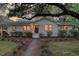 Charming single-story home with a manicured lawn, lush landscaping, and a welcoming front entrance at 5155 Monterey St, North Charleston, SC 29405