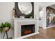 Cozy fireplace with stone surround, decorated mantel and modern electric fire display at 5155 Monterey St, North Charleston, SC 29405