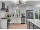 Modern kitchen with stainless steel appliances, stylish light fixtures, and a gray kitchen island at 5155 Monterey St, North Charleston, SC 29405