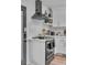 Modern kitchen featuring stainless steel appliances, floating shelves and a gas range at 5155 Monterey St, North Charleston, SC 29405