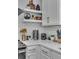 Close-up of a kitchen with white cabinetry, quartz countertops, and stainless steel appliances at 5155 Monterey St, North Charleston, SC 29405