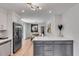 Open eat-in kitchen showcasing stainless steel appliances, a gray island, and an adjacent dining area at 5155 Monterey St, North Charleston, SC 29405