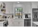 Bright kitchen featuring white cabinetry, stainless steel appliances, and quartz countertops at 5155 Monterey St, North Charleston, SC 29405